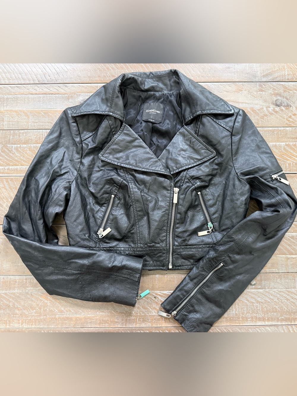 bebe Black Genuine Leather Cropped Moto Jacket with heavy duty silver zippers